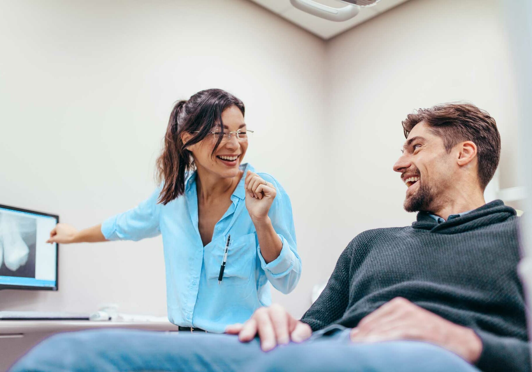 dentist happily discussed about financial info to patient
